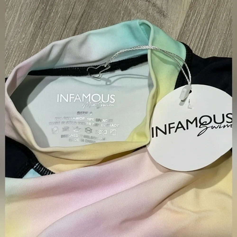 Infamous mini swim rash guard shirt size 0 Tie-dye design with black sleeves NWT